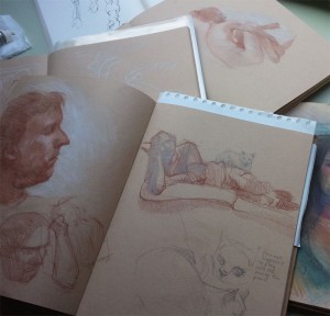 A small pile of sketchbooks